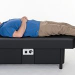 man lying on hydromassage table