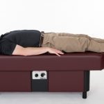 man laying on ComfortWave hydromassage table