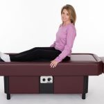 lady getting legs massaged on hydromassage table