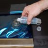 pour Clar-Lub into fill spout on hydrotable